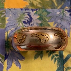 Silver Cuff bracelet adorned with 5 gold toned bears.